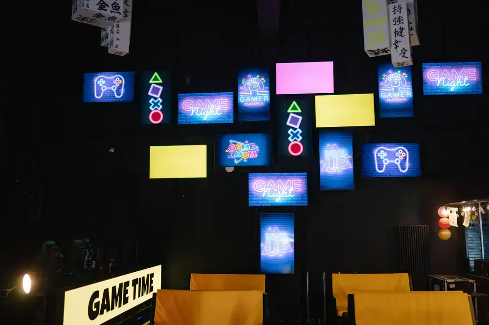 Arcade room lit up with colorful screens